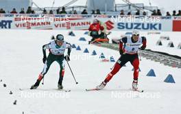 Ski Jumping - FIS Nordic World Ski Championchips - Nordic Combined Individual 15 km - Sapporo (JPN) - 03.03.07: Sprint finish, left to right: Anssi Koivuranta (FIN), Bill Demong (USA)