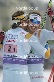 28.10.2007, Duesseldorf, Germany (GER): l-r: Thobias Fredriksson (SWE), Peter Larsson (SWE), winner, emotions - FIS world cup cross-country, team sprint, Duesseldorf. www.nordicfocus.com. c Hemmersbach/NordicFocus. Every downloaded picture is fee-liable.