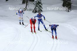 09.12.2007, Davos (SUI): Maxim Vylegzhanin (RUS) leads Simen Oestensen (NOR), Roland Clara (ITA) and Mats Larsson (SWE) - FIS World Cup cross-country, relay men - Davos (SUI). www.nordicfocus.com. c Manzoni/NordicFocus. Every downloaded picture is fee-liable.
