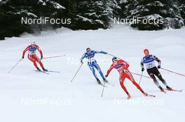 09.12.2007, Davos (SUI): Odd-Bjoern Hjelmeset (NOR) leads Axel Teichmann (GER), Valerio Checchi (ITA), Jens Arne Svartedal (NOR)  FIS World Cup cross-country, relay men - Davos (SUI). www.nordicfocus.com. c Manzoni/NordicFocus. Every downloaded picture is fee-liable.
