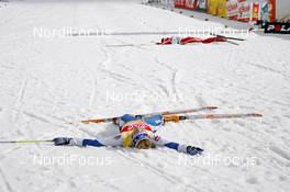 16.03.2008, Bormio, Italy (ITA): Virpi Kuitunen (FIN) and Justyna Kowalczyk (POL) completely exhausted in the finish area - FIS world cup cross-country, 10km women, Bormio (ITA). www.nordicfocus.com. c Felgenhauer/NordicFocus. Every downloaded picture is fee-liable.
