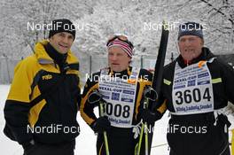 02.02.2008, Oberammergau, Germany (GER): l-r: Steffen Hoos, Toko Service Team, Sergei Rozhkov (RUS) and a fan at the finish of Koenig Ludwig Lauf - Worldloppet Koenig Ludwig Lauf - Oberammergau (GER). www.nordicfocus.com. c Felgenhauer/NordicFocus. Every downloaded picture is fee-liable.