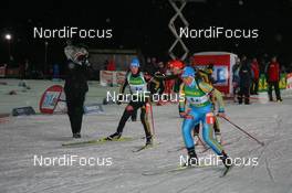 07.01.2009, Oberhof, Germany (GER): Last handover: Kathrin Hitzer (GER), Fischer, Rottefella, Madshus, Leki, adidas, Sabrina Buchholz (GER), Rossignol, Rottefella, Leki, adidas, Oksana Khvostenko (UKR), Fischer, Salomon, Swix - IBU world cup biathlon, relay women, Oberhof (GER). www.nordicfocus.com. © Manzoni/NordicFocus. Every downloaded picture is fee-liable.