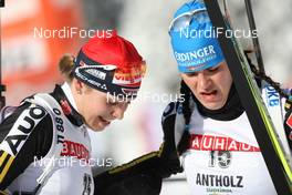 24.01.2009, Antholz, Italy (ITA): Magdalena Neuner (GER), Fischer, Rottefella, Exel, adidas and Kathrin Hitzer (GER), Fischer, Rottefella, Madshus, Leki, adidas - IBU world cup biathlon, pursuit women, Antholz (ITA). www.nordicfocus.com. © Manzoni/NordicFocus. Every downloaded picture is fee-liable.