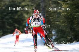 11.03.2009, Vancouver, Canada (CAN): Tobias Eberhard (AUT), Atomic, Swix - IBU world cup biathlon, individual men, Vancouver (CAN). www.nordicfocus.com. © Manzoni/NordicFocus. Every downloaded picture is fee-liable.