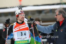 15.03.2009, Vancouver, Canada (CAN): Michael Roesch (GER), Fischer, Rottefella, Exel, adidas, Toko and Norbert Baier (GER), IBU head TD - IBU world cup biathlon, relay men, Vancouver (CAN). www.nordicfocus.com. © Manzoni/NordicFocus. Every downloaded picture is fee-liable.