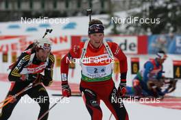 15.03.2009, Vancouver, Canada (CAN): Alexander Os (NOR), Fischer, Rottefella, Swix, Odlo and Michael Roesch (GER), Fischer, Rottefella, Exel, adidas, Toko - IBU world cup biathlon, relay men, Vancouver (CAN). www.nordicfocus.com. © Manzoni/NordicFocus. Every downloaded picture is fee-liable.