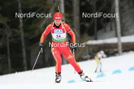 13.03.2009, Vancouver, Canada (CAN): Xue Dong (CHN), Fischer, Salomon, Swix, adidas - IBU world cup biathlon, sprint women, Vancouver (CAN). www.nordicfocus.com. © Manzoni/NordicFocus. Every downloaded picture is fee-liable.