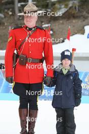 13.03.2009, Vancouver, Canada (CAN): Mountie with Biathlon Kid - IBU world cup biathlon, sprint women, Vancouver (CAN). www.nordicfocus.com. © Manzoni/NordicFocus. Every downloaded picture is fee-liable.