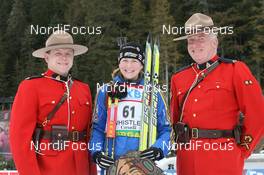 13.03.2009, Vancouver, Canada (CAN): Helena Jonsson (SWE), Fischer, Rottefella, Leki, adidas with mounties - IBU world cup biathlon, sprint women, Vancouver (CAN). www.nordicfocus.com. © Manzoni/NordicFocus. Every downloaded picture is fee-liable.