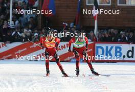 28.03.2009, Khanty-Mansiysk, Russia (RUS): Ole Einar Bjoerndalen (NOR), Madshus, Rottefella, Odlo and Emil Hegle Svendsen (NOR), Madshus, Rottefella, Swix, Odlo - IBU world cup biathlon, pursuit men, Khanty-Mansiysk (RUS). www.nordicfocus.com. © Manzoni/NordicFocus. Every downloaded picture is fee-liable.