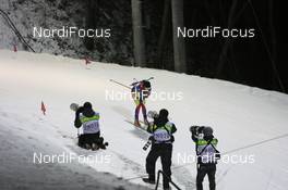 18.02.2009, Pyeong Chang, Korea (KOR): photographers take pictures of Natalia Levtchenkova (MDA), Fischer, Rottefella, Alpina, Swix - Feature - IBU world championships biathlon, individual women, Pyeong Chang (KOR). www.nordicfocus.com. © Manzoni/NordicFocus. Every downloaded picture is fee-liable.