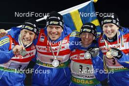 12.02.2009, Pyeong Chang, Korea (KOR): swedish team, l-r:  Carl-Johan Bergman (SWE), Rossignol, Leki, adidas,David Ekholm (SWE), Madshus, Rottefella, adidas, Anna Carin Olofsson (SWE), Madshus, Rottefella, Leki, adidas, Helena Jonsson (SWE), Fischer, Rottefella, Leki, adidas  - IBU world championships biathlon, medals, Pyeong Chang (KOR). www.nordicfocus.com. © Felgenhauer/NordicFocus. Every downloaded picture is fee-liable.