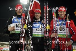 12.02.2009, Pyeong Chang, Korea (KOR): l-r:  Lars Berger (NOR), Madshus, Rottefella, Odlo,Ole Einar Bjoerndalen (NOR), Madshus, Rottefella, Odlo, Halvard Hanevold (NOR), Madshus, Rottefella, Swix, Odlo  - IBU world championships biathlon, medals, Pyeong Chang (KOR). www.nordicfocus.com. © Felgenhauer/NordicFocus. Every downloaded picture is fee-liable.