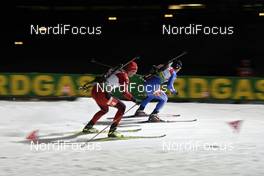 15.02.2009, Pyeong Chang, Korea (KOR): l-r: Alexander Os (NOR), Fischer, Rottefella, Odlo, Maxim Tchoudov (RUS), Madshus, Rottefella, Swix/Exel, adidas  - IBU world championships biathlon, pursuit men, Pyeong Chang (KOR). www.nordicfocus.com. © Felgenhauer/NordicFocus. Every downloaded picture is fee-liable.