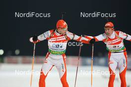 19.02.2009, Pyeong Chang, Korea (KOR): Roland Lessing (EST), Fischer, Rottefella, Exel and Indrek Tobreluts (EST), Madshus, Rottefella, Swix - IBU world championships biathlon, relay mixed, Pyeong Chang (KOR). www.nordicfocus.com. © Manzoni/NordicFocus. Every downloaded picture is fee-liable.