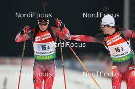 19.02.2009, Pyeong Chang, Korea (KOR): Robin Clegg (CAN), Rossignol, Rottefella, Leki and Jean Philippe Leguellec (CAN), Rossignol, Rottefella, Exel - IBU world championships biathlon, relay mixed, Pyeong Chang (KOR). www.nordicfocus.com. © Manzoni/NordicFocus. Every downloaded picture is fee-liable.