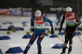 19.02.2009, Pyeong Chang, Korea (KOR): Sylvie Becaert (FRA), Fischer, Rottefella, Exel, Odlo, Simone Hauswald (GER), Fischer, Rottefella, Exel, adidas, Toko - IBU world championships biathlon, relay mixed, Pyeong Chang (KOR). www.nordicfocus.com. © Manzoni/NordicFocus. Every downloaded picture is fee-liable.