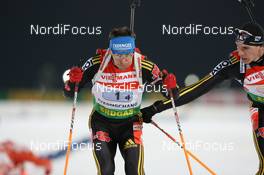 19.02.2009, Pyeong Chang, Korea (KOR): Michael Greis (GER), Madshus, Rottefella, Exel, adidas and Arnd Peiffer (GER), Fischer, Salomon, Swix, adidas - IBU world championships biathlon, relay mixed, Pyeong Chang (KOR). www.nordicfocus.com. © Manzoni/NordicFocus. Every downloaded picture is fee-liable.