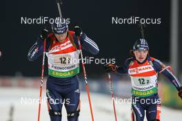 19.02.2009, Pyeong Chang, Korea (KOR): Jeremy Teela (USA), Madshus, Rottefella, Alpina, Exel, adidas and Laura Spector (USA), Madshus, Rottefella, Exel, adidas - IBU world championships biathlon, relay mixed, Pyeong Chang (KOR). www.nordicfocus.com. © Manzoni/NordicFocus. Every downloaded picture is fee-liable.