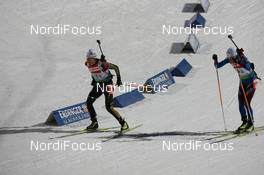 19.02.2009, Pyeong Chang, Korea (KOR): Simone Hauswald (GER), Fischer, Rottefella, Exel, adidas, Toko and Sylvie Becaert (FRA), Fischer, Rottefella, Exel, Odlo - IBU world championships biathlon, relay mixed, Pyeong Chang (KOR). www.nordicfocus.com. © Manzoni/NordicFocus. Every downloaded picture is fee-liable.