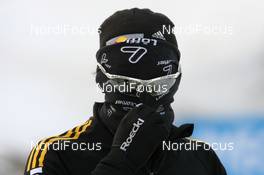 10.02.2009, Pyeong Chang, Korea (KOR): Michael Roesch (GER), Fischer, Rottefella, Exel, adidas, Toko hiding his face - IBU world championships biathlon, training, Pyeong Chang (KOR). www.nordicfocus.com. © Manzoni/NordicFocus. Every downloaded picture is fee-liable.