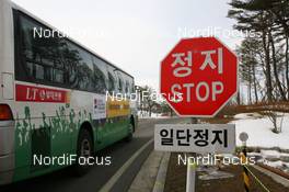09.02.2009, Pyeong Chang, Korea (KOR): WCH Feature - Roadsign with shuttlebus - IBU world championships biathlon, training, Pyeong Chang (KOR). www.nordicfocus.com. © Manzoni/NordicFocus. Every downloaded picture is fee-liable.