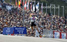 26.09.2009, Oberhof (GER): athlete in front of the spectators - IBU Sommer Biathlon Worldchampionship, sprint women - Oberhof (GER). www.nordicfocus.com. © NordicFocus. Every downloaded picture is fee-liable.