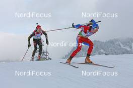 12.12.2009, Hochfilzen, Austria (AUT): Michal Slesingr (CZE), Rossignol, Rottefella, Leki leads Simon Schempp (GER), Fischer, Rottefella, Alpina, Leki, adidas  - IBU world cup biathlon, pursuit men, Hochfilzen (AUT). www.nordicfocus.com. © Manzoni/NordicFocus. Every downloaded picture is fee-liable.