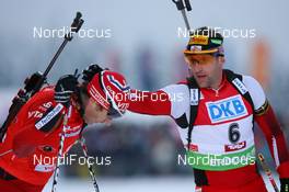 12.12.2009, Hochfilzen, Austria (AUT): Ole Einar Bjoerndalen (NOR), Madshus, Rottefella, Odlo and Christoph Sumann (AUT), Atomic, Leki  - IBU world cup biathlon, pursuit men, Hochfilzen (AUT). www.nordicfocus.com. © Manzoni/NordicFocus. Every downloaded picture is fee-liable.