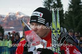04.01.2009, Val di Fiemme, Italy (ITA): TdS overall winner Dario Cologna (SUI), Fischer, Rottefella, Alpina, Swix, adidas  - FIS world cup cross-country, tour de ski, final climb men, Val di Fiemme (ITA). www.nordicfocus.com. © Hemmersbach/NordicFocus. Every downloaded picture is fee-liable.