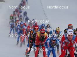 30.01.2009, Rybisnk, Russia (RUS): group, in the focus, Dario Cologna (SUI), Fischer, Rottefella, Alpina, Swix, adidas and Rene Sommerfeldt (GER), Madshus, Salomon, Leki, adidas  - FIS world cup cross-country, mass men, Rybinsk (RUS). www.nordicfocus.com. © Hemmersbach/NordicFocus. Every downloaded picture is fee-liable.