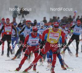 30.01.2009, Rybisnk, Russia (RUS): group, in front Dario Cologna (SUI), Fischer, Rottefella, Alpina, Swix, adidas, behind him Remo Fischer (SUI), Fischer, Rottefella, Alpina, KV+, adidas  - FIS world cup cross-country, mass men, Rybinsk (RUS). www.nordicfocus.com. © Hemmersbach/NordicFocus. Every downloaded picture is fee-liable.