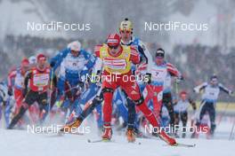 30.01.2009, Rybisnk, Russia (RUS): group, in front Dario Cologna (SUI), Fischer, Rottefella, Alpina, Swix, adidas, behind Pietro Piller Cottrer (ITA), Rossignol, Rottefella, One Way, topshot - FIS world cup cross-country, mass men, Rybinsk (RUS). www.nordicfocus.com. © Hemmersbach/NordicFocus. Every downloaded picture is fee-liable.