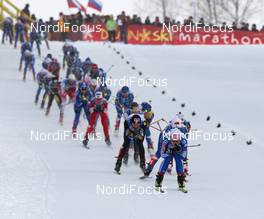 30.01.2009, Rybisnk, Russia (RUS): group, in front Evgenia Medvedeva (RUS), Fischer, Rottefella, Swix, adidas, behind left Justyna Kowalczyk (POL), Fischer, Salomon, Swix  - FIS world cup cross-country, mass women, Rybinsk (RUS). www.nordicfocus.com. © Hemmersbach/NordicFocus. Every downloaded picture is fee-liable.