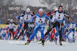 30.01.2009, Rybisnk, Russia (RUS): group, in front Evgenia Medvedeva (RUS), Fischer, Rottefella, Swix, adidas, behind right Justyna Kowalczyk (POL), Fischer, Salomon, Swix  - FIS world cup cross-country, mass women, Rybinsk (RUS). www.nordicfocus.com. © Hemmersbach/NordicFocus. Every downloaded picture is fee-liable.