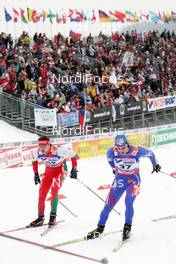 01.03.2009, Liberec, Czech Republic (CZE): feature , spectators , l-r , Sergej Kuzmenko (BLR) , Madshus , Milan Sperl (CZE), Fischer, Salomon   - FIS nordic world ski championships, cross-country, mass men, Liberec (CZE). www.nordicfocus.com. © Domanski/NordicFocus. Every downloaded picture is fee-liable.