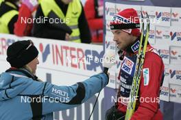 01.03.2009, Liberec, Czech Republic (CZE): l-r: Sandra Spitz FIS, Petter Northug (NOR), Fischer, Rottefella, Alpina, Ski Go, Swix  - FIS nordic world ski championships, cross-country, mass men, Liberec (CZE). www.nordicfocus.com. © Furtner/NordicFocus. Every downloaded picture is fee-liable.