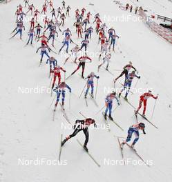 28.02.2009, Liberec, Czech Republic (CZE): group, start, in front l-r Justyna Kowalczyk (POL), Fischer, Salomon, Swix, Aino Kaisa Saarinen (FIN), Rossignol, Rottefella, One Way, Kristin Stoermer Steira (NOR), Madshus, Rottefella, One Way, Swix  - FIS nordic world ski championships, cross-country, mass women, Liberec (CZE). www.nordicfocus.com. © Hemmersbach/NordicFocus. Every downloaded picture is fee-liable.