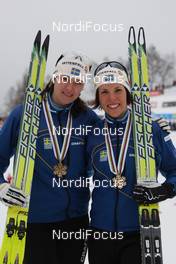 27.02.2009, Liberec, Czech Republic (CZE): medal, l-r Britta Norgren (SWE), Fischer, Rottefella, Swix, Craft, Charlotte Kalla (SWE), Fischer, Salomon, Swix, Craft  - FIS nordic world ski championships, cross-country, medals, Liberec (CZE). www.nordicfocus.com. © Hemmersbach/NordicFocus. Every downloaded picture is fee-liable.
