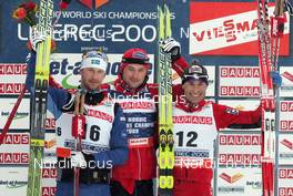 22.02.2009, Liberec, Czech Republic (CZE): podium , Anders Soedergren (SWE), Fischer, Salomon, Craft , Petter Northug (NOR), Fischer, Rottefella, Alpina, Ski Go, Swix  , Girogio di Centa (ITA), Atomic, Swix, Rudy Project  - FIS nordic world ski championships, cross-country, pursuit men, Liberec (CZE). www.nordicfocus.com. © Domanski/NordicFocus. Every downloaded picture is fee-liable.