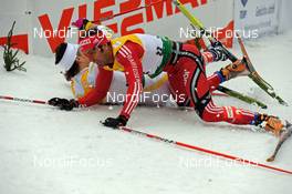 05.12.2009, Duesseldorf, Germany (GER): Thobias Fredriksson (SWE), Fischer, Rottefella  and Christoph Eigenmann (SUI), Rossignol, Rottefella, Exel, adidas, Toko crashing - FIS world cup cross-country, individual sprint, Duesseldorf. www.nordicfocus.com. © Marco Felgenhauer/NordicFocus. Every downloaded picture is fee-liable.