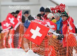 12.12.2009, Davos, Switzerland (SUI): Feature, spectators with swiss flag - FIS world cup cross-country, 15km men, Davos (SUI). www.nordicfocus.com. © Hemmersbach/NordicFocus. Every downloaded picture is fee-liable.