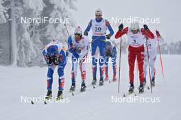 19.12.2009, Rogla, Slovenia (SLO): group, in front left Kalle Lassila (FIN), Fischer, in front right Andrew Newell (USA), Fischer, Salomon  - FIS world cup cross-country, individual sprint, Rogla (SLO). www.nordicfocus.com. © Hemmersbach/NordicFocus. Every downloaded picture is fee-liable.