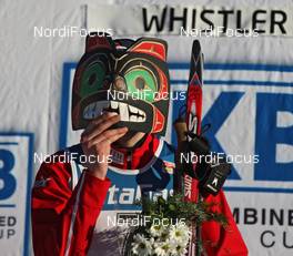 17.01.2009, Vancouver, Canada (CAN): Magnus Moan (NOR), Madshus, Rottefella, holding an indian carving in front of his face, topshot - FIS world cup nordic combined, individual gundersen HS140/10km, Vancouver (CAN). www.nordicfocus.com. © Hemmersbach/NordicFocus. Every downloaded picture is fee-liable.