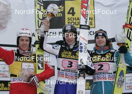 01.01.2009, Garmisch, Germany (GER): l-r: Simon Ammann (SUI), Fischer, adidas, Wolfgang Loitzl (AUT), Atomic, Harri Olli (FIN), Fischer  - FIS world cup ski jumping, four hills tournament, individual HS140, Garmisch (GER). www.nordicfocus.com. © Furtner/NordicFocus. Every downloaded picture is fee-liable.