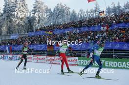 07.01.2010, Oberhof, Germany (GER): (r-l) Simon Fourcade (FRA), Fischer, Rottefella, Swix, Odlo,  Dominik Landertinger (AUT), Fischer, Rottefella, Leki, Arnd Peiffer (GER), Fischer, Salomon, Swix, adidas - IBU world cup biathlon, relay men, Oberhof (GER). www.nordicfocus.com. © Trienitz/NordicFocus. Every downloaded picture is fee-liable.