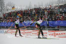 09.01.2010, Oberhof, Germany (GER): Arnd Peiffer (GER), Fischer, Salomon, Swix, adidas, Michael Greis (GER), Madshus, Rottefella, Exel, adidas  - IBU world cup biathlon, sprint men, Oberhof (GER). www.nordicfocus.com. © Trienitz/NordicFocus. Every downloaded picture is fee-liable.