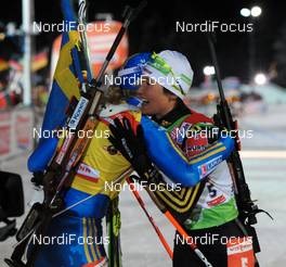 16.01.2010, Ruhpolding, Germany (GER): l-r: Helena Jonsson (SWE), Fischer, Rottefella, Leki, adidas, Simone Hauswald (GER), Fischer, Rottefella, Exel, adidas, Toko  - IBU world cup biathlon, mass women, Ruhpolding (GER). www.nordicfocus.com. © Felgenhauer/NordicFocus. Every downloaded picture is fee-liable.