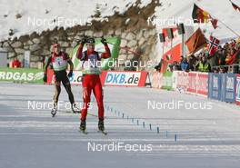 24.01.2010, Antholz, Italy (ITA): Daniel Mesotitsch (AUT), Fischer, Rottefella, Leki wins in front of Daniel Mesotitsch (AUT), Fischer, Rottefella, Leki - IBU world cup biathlon, pursuit men, Antholz (ITA). www.nordicfocus.com. © Manzoni/NordicFocus. Every downloaded picture is fee-liable.